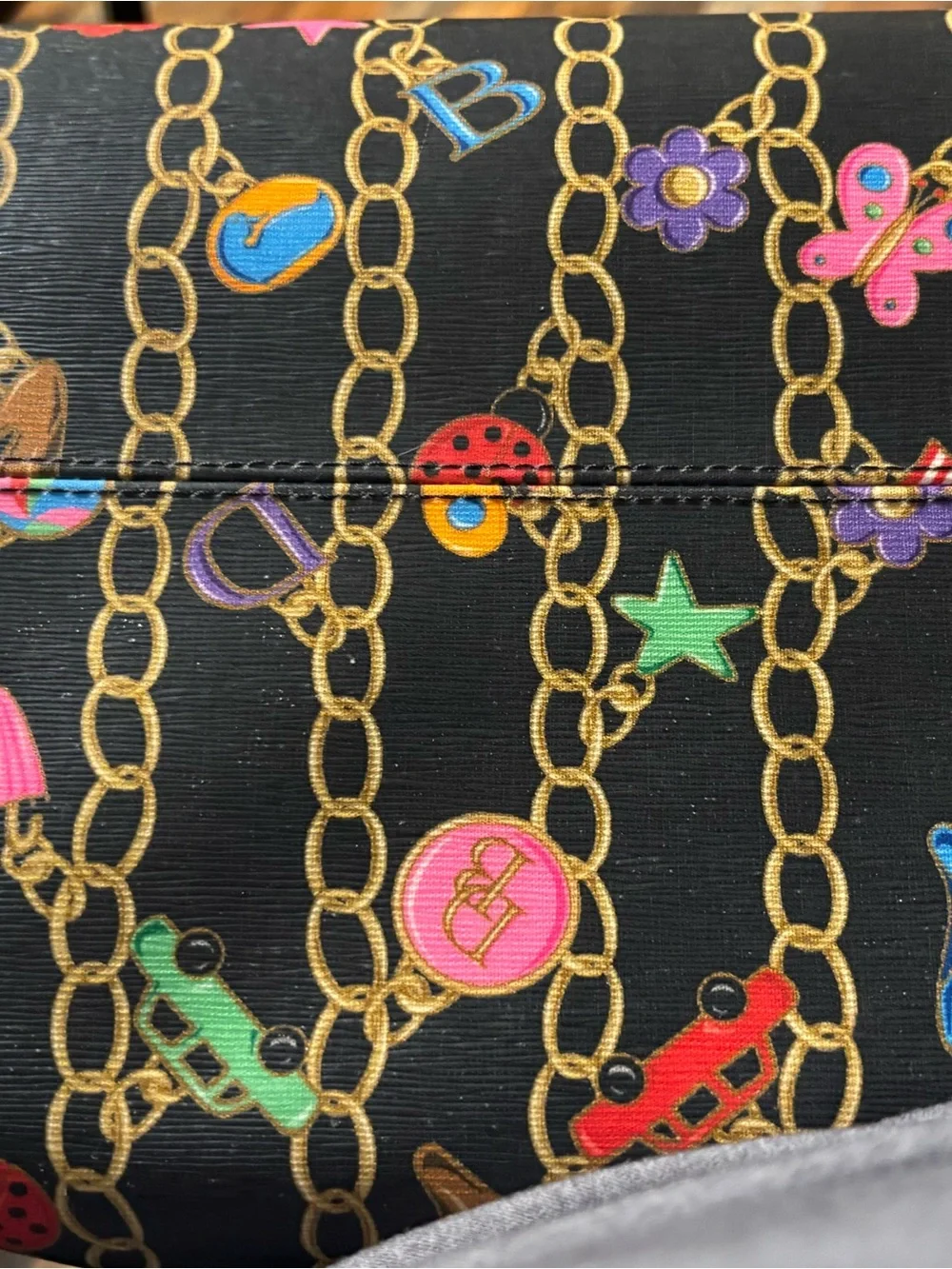 Dooney & Bourke Black Satchel with Multicolor Chain Charm Print